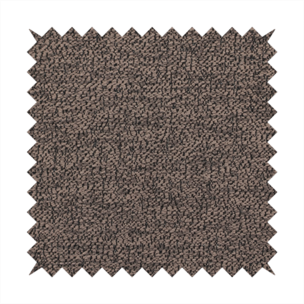 A dark brown textured fabric with a dense, irregular black speckled pattern.