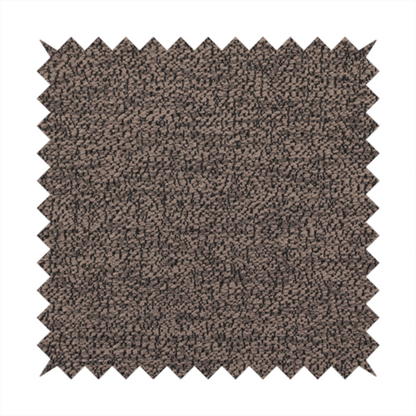 A dark brown textured fabric with a dense, irregular black speckled pattern.