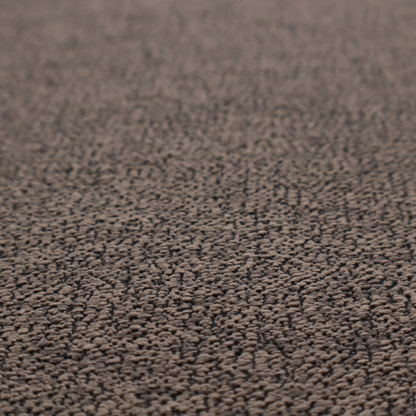 A dark brown textured fabric with a dense, irregular black speckled pattern.