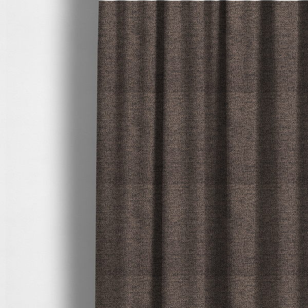 The fabric used to create these made-to-measure curtains is a dark brown textured fabric with a dense, irregular black speckled pattern.