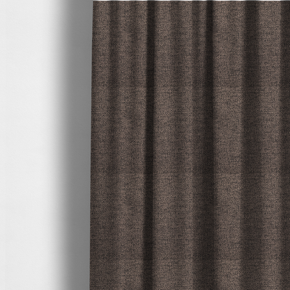 The fabric used to create these made-to-measure curtains is a dark brown textured fabric with a dense, irregular black speckled pattern.