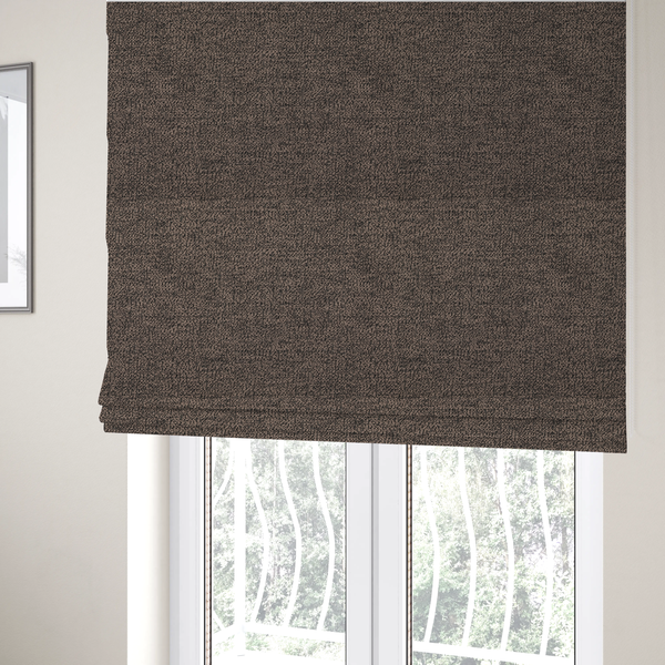 The fabric used to create these Roman blinds is a dark brown textured fabric with a dense, irregular black speckled pattern.