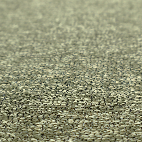 A sage green textured fabric with a dense, irregular black speckled pattern.