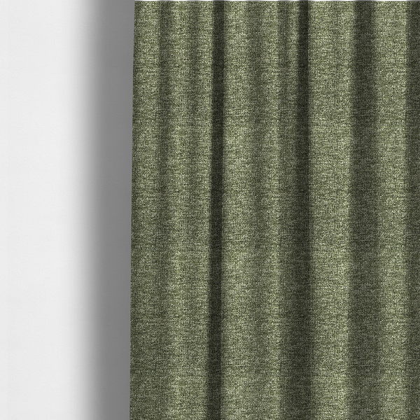 The fabric used to create these made-to-measure curtains is a A sage green textured fabric with a dense, irregular black speckled pattern.