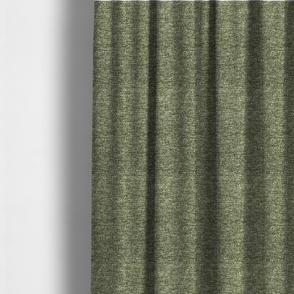 The fabric used to create these made-to-measure curtains is a A sage green textured fabric with a dense, irregular black speckled pattern.