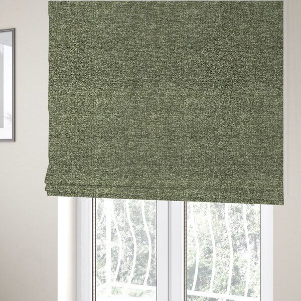 The fabric used to create these Roman binds is a sage green textured fabric with a dense, irregular black speckled pattern.