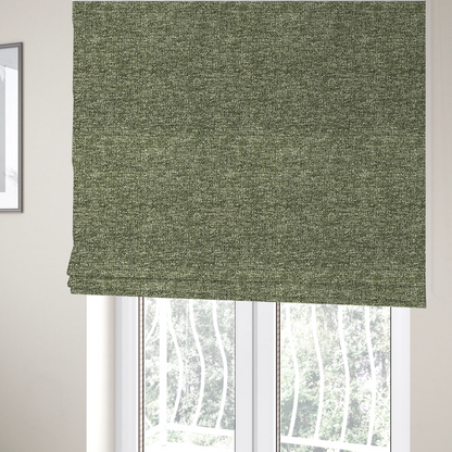 The fabric used to create these Roman binds is a sage green textured fabric with a dense, irregular black speckled pattern.