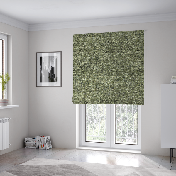The fabric used to create these Roman binds is a sage green textured fabric with a dense, irregular black speckled pattern.