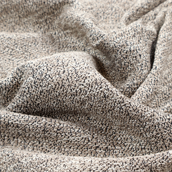 An ash brown textured fabric with a dense, irregular black speckled pattern.