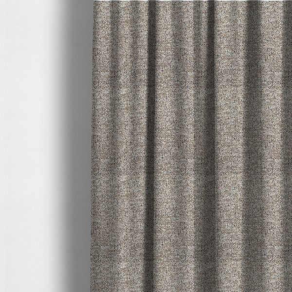 The fabric used to create these made-to-measure curtains is a ash brown textured fabric with a dense, irregular black speckled pattern.