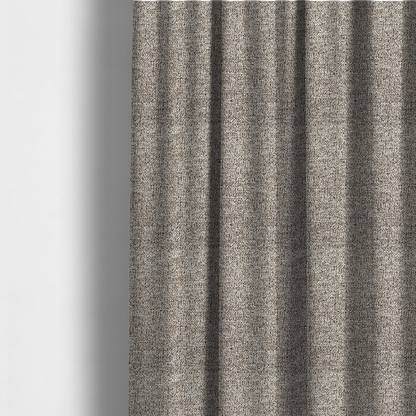 The fabric used to create these made-to-measure curtains is a ash brown textured fabric with a dense, irregular black speckled pattern.