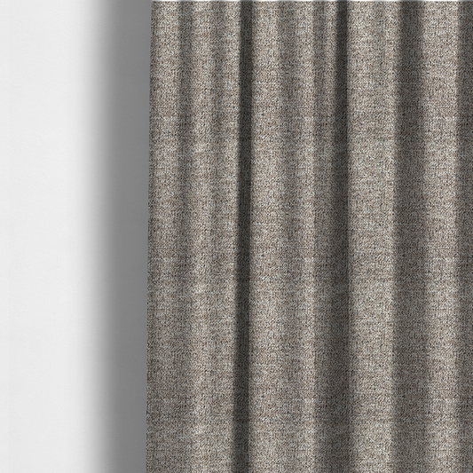 The fabric used to create these made-to-measure curtains is a ash brown textured fabric with a dense, irregular black speckled pattern.