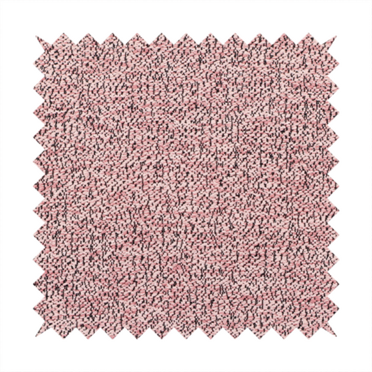 A dusty rose textured fabric with a dense, irregular black speckled pattern.