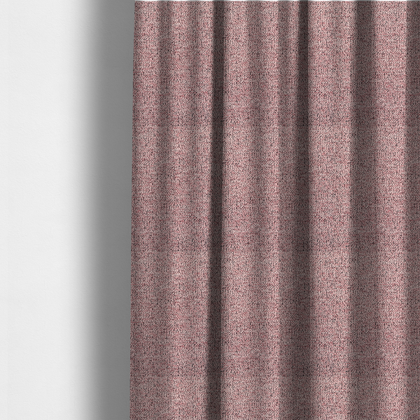 The fabric used to create these made-to-measure curtains is a dusty rose textured fabric with a dense, irregular black speckled pattern.