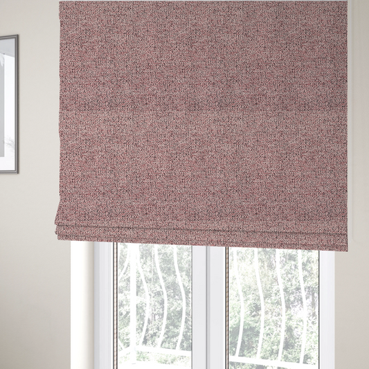 The fabric used to create these Roman blinds is a dusty rose textured fabric with a dense, irregular black speckled pattern.
