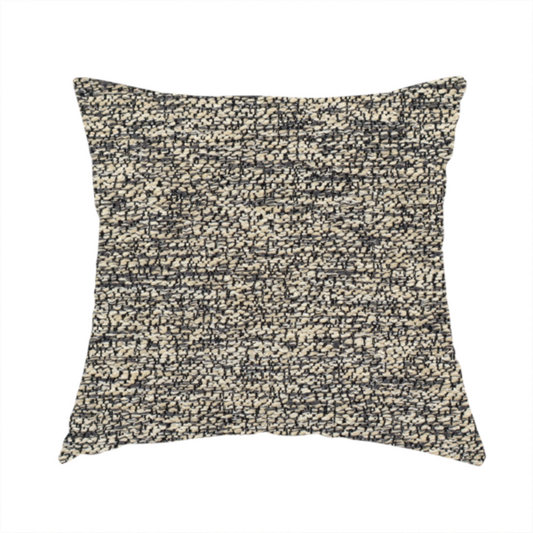 The fabric used to create this handmade cushion is a fossil grey and cream textured fabric with a dense, irregular speckled pattern.