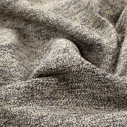 A fossil grey and cream textured fabric with a dense, irregular speckled pattern.