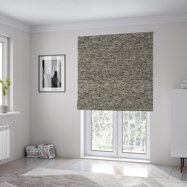 The fabric used to create these Roman blinds is a fossil grey and cream textured fabric with a dense, irregular speckled pattern.