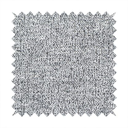 A light grey or silver textured fabric with an integrated black speckled motif, creating a cool-toned, high-contrast pebbled appearance.