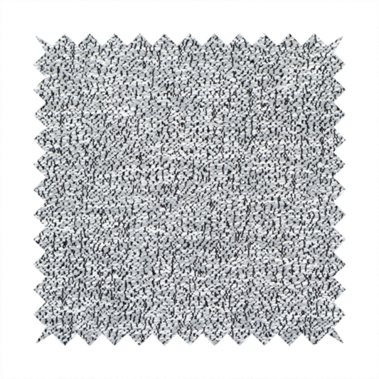 A light grey or silver textured fabric with an integrated black speckled motif, creating a cool-toned, high-contrast pebbled appearance.