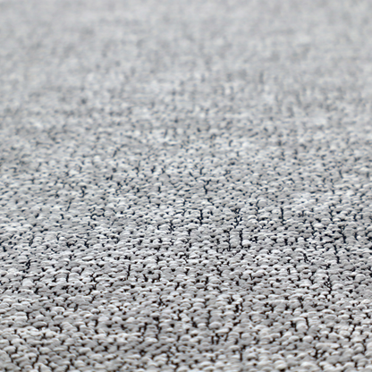 A light grey or silver textured fabric with an integrated black speckled motif, creating a cool-toned, high-contrast pebbled appearance.