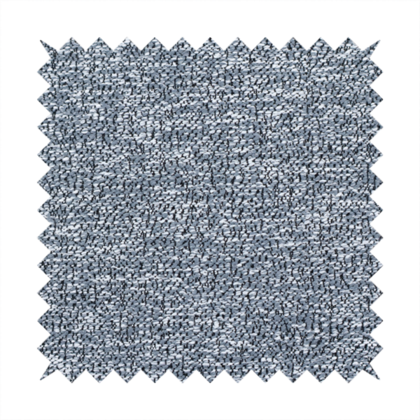 A silver-grey textured fabric with a dense, irregular black speckled pattern.