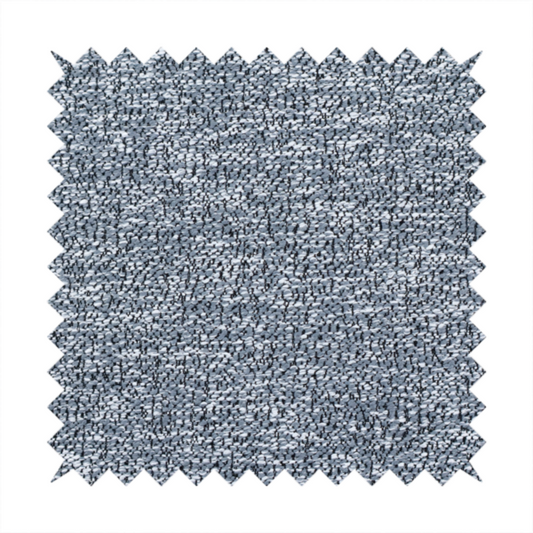A silver-grey textured fabric with a dense, irregular black speckled pattern.