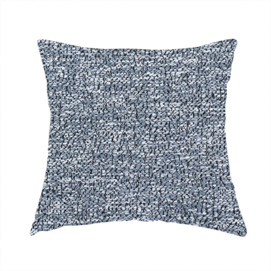 The fabric used to create these handmade cushions is a silver-grey textured fabric with a dense, irregular black speckled pattern.