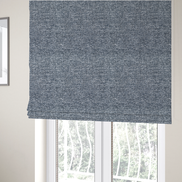 The fabric used to create these Roman blinds is a silver-grey textured fabric with a dense, irregular black speckled pattern.