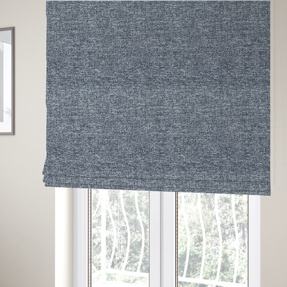 The fabric used to create these Roman blinds is a silver-grey textured fabric with a dense, irregular black speckled pattern.