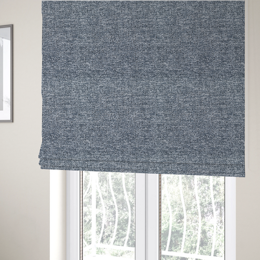 The fabric used to create these Roman blinds is a silver-grey textured fabric with a dense, irregular black speckled pattern.