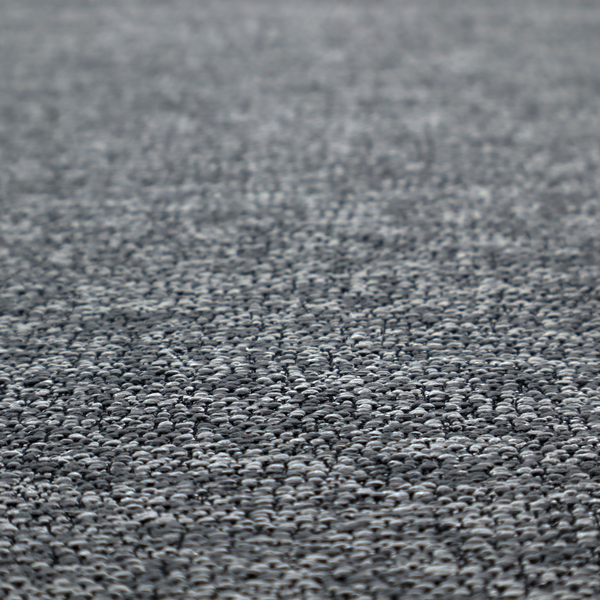 A charcoal grey textured fabric with a dense, irregular black and light grey speckled pattern, creating a high-contrast pebbled surface.