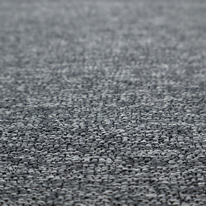 A charcoal grey textured fabric with a dense, irregular black and light grey speckled pattern, creating a high-contrast pebbled surface.