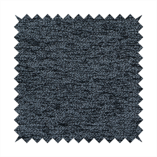 A charcoal grey textured fabric with a dense black speckled pattern, creating a dark, moody salt-and-pepper effect with a heavy pebbled weave.