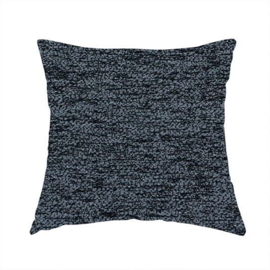 The fabric used to create these handmade cushions is a charcoal grey textured fabric with a dense black speckled pattern, creating a dark, moody salt-and-pepper effect with a heavy pebbled weave.