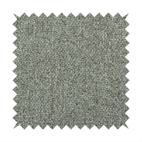 A textured woven upholstery fabric. The material features a dense, multi-tonal weave of sage green, grey, and beige threads, creating a speckled effect with a tactile, matte finish.