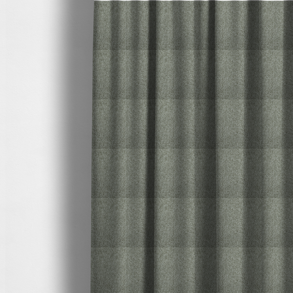 The fabric used to create these made-to-measure curtains is a textured woven upholstery fabric. The material features a dense, multi-tonal weave of sage green, grey, and beige threads, creating a speckled effect with a tactile, matte finish.