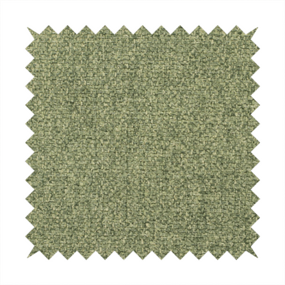 A green Chamonix upholstery fabric. The material features a dense, multi-tonal basket weave texture with a matte finish, ideal for durable and stylish furniture.