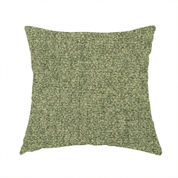 The fabric used to create these handmade cushions is a green Chamonix upholstery fabric. The material features a dense, multi-tonal basket weave texture with a matte finish, ideal for durable and stylish furniture.