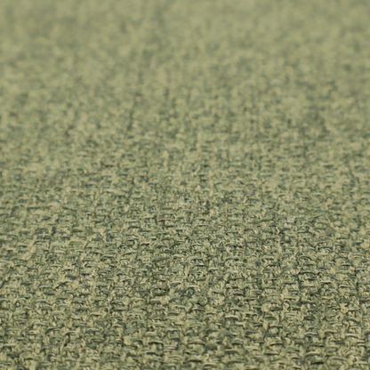 A green Chamonix upholstery fabric. The material features a dense, multi-tonal basket weave texture with a matte finish, ideal for durable and stylish furniture.