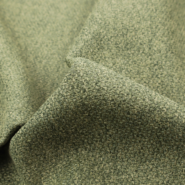 A green Chamonix upholstery fabric. The material features a dense, multi-tonal basket weave texture with a matte finish, ideal for durable and stylish furniture.