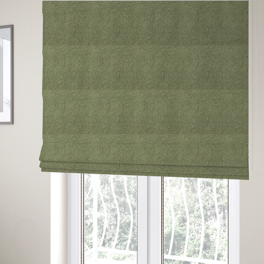 The fabric used to create these Roman blinds is a green Chamonix upholstery fabric. The material features a dense, multi-tonal basket weave texture with a matte finish, ideal for durable and stylish furniture.