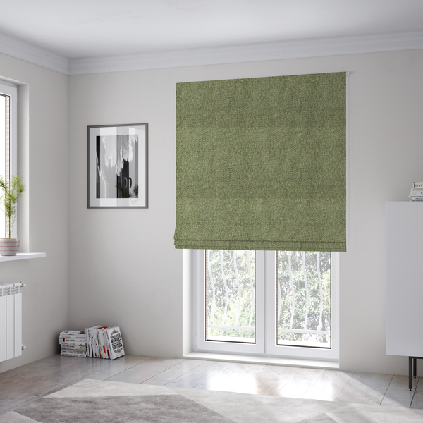 The fabric used to create these Roman blinds is a green Chamonix upholstery fabric. The material features a dense, multi-tonal basket weave texture with a matte finish, ideal for durable and stylish furniture.