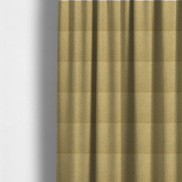 The fabric used to create these made-to-measure curtains is a Chamonix Water Repellent upholstery fabric in Pear Green. A vibrant, citrus-toned material featuring a dense basket weave texture and a durable, matte finish.