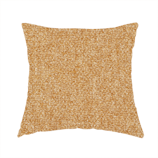 The fabric used to create these handmade cushions is a Chamonix Water Repellent upholstery fabric in Yellow. The material features a dense, multi-tonal basket weave texture with sunny golden and cream threads and a durable, matte finish.