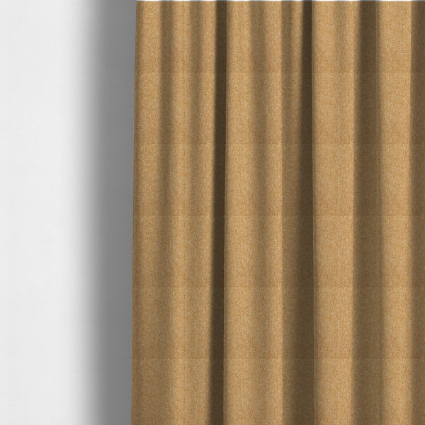 The fabric used to create these made-to-measure curtains is a Chamonix Water Repellent upholstery fabric in Yellow. The material features a dense, multi-tonal basket weave texture with sunny golden and cream threads and a durable, matte finish.