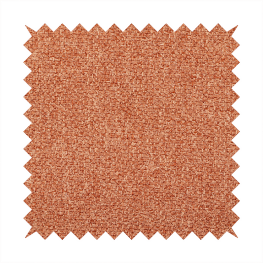 A Chamonix Water Repellent upholstery fabric in Orange. The material features a dense, multi-tonal rust orange basket weave texture with a durable, matte finish.
