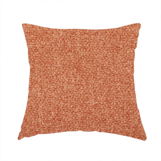 The fabric used to create these handmade cushions is a Chamonix Water Repellent upholstery fabric in Orange. The material features a dense, multi-tonal rust orange basket weave texture with a durable, matte finish.
