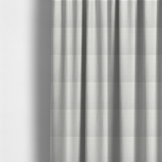 The fabric used to create these made-to-measure curtains is a Chamonix Water Repellent upholstery fabric in White. The material features a dense, textured basket weave with a clean, matte finish and high-durability construction.