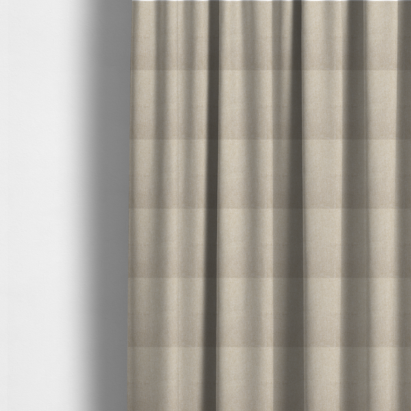 The fabric used to create these made-to-measure curtains is a Chamonix Water Repellent upholstery fabric in Cream. The material features a dense, multi-tonal basket weave texture with warm ivory and off-white threads and a durable, matte finish.